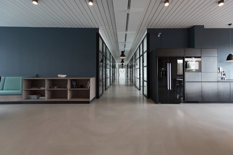 A staff pantry with a run of joinery and a ribbed ceiling above